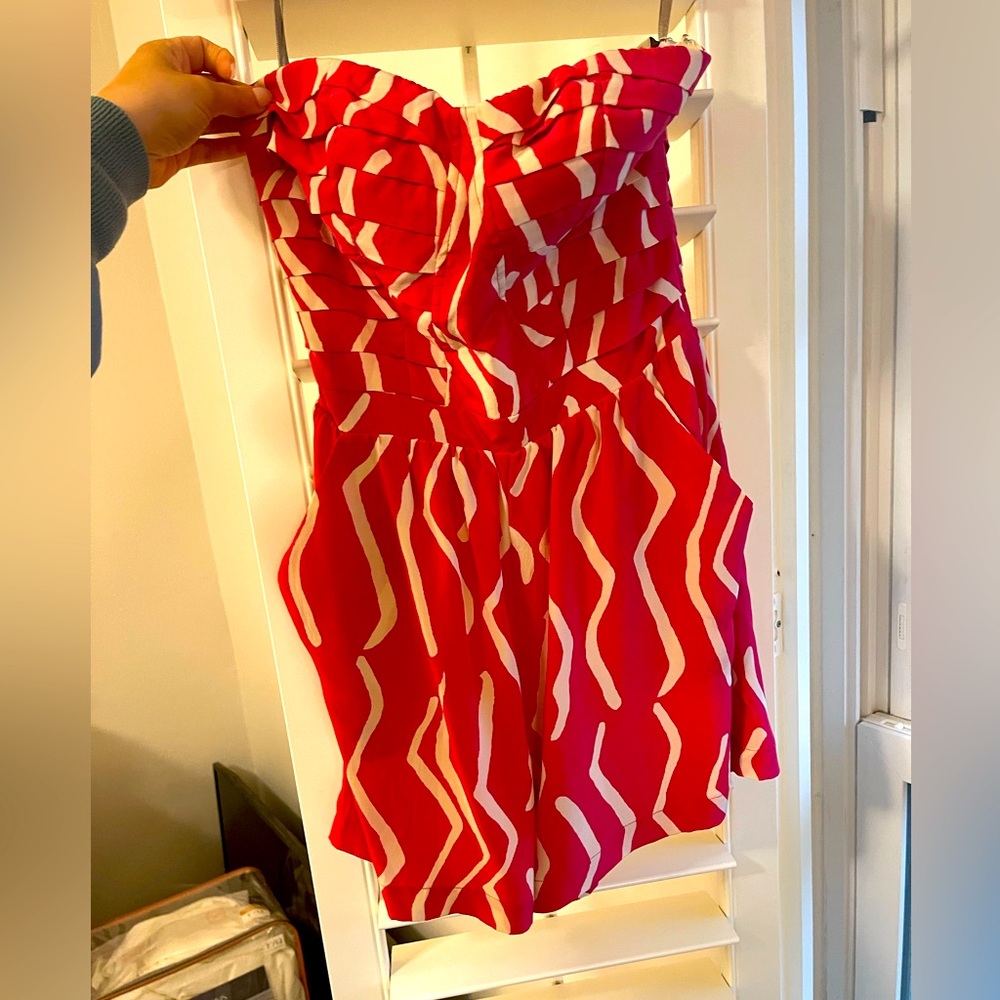 Bright pink and white strapless romper